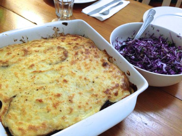 Baked moussaka and red cabbage salad