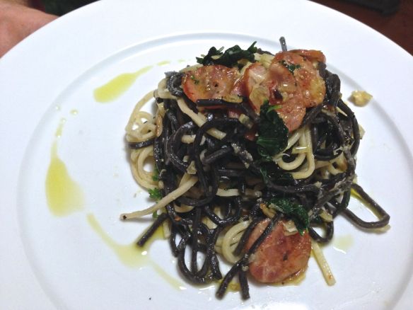 linguine with stinging nettles and chorizo on a plate